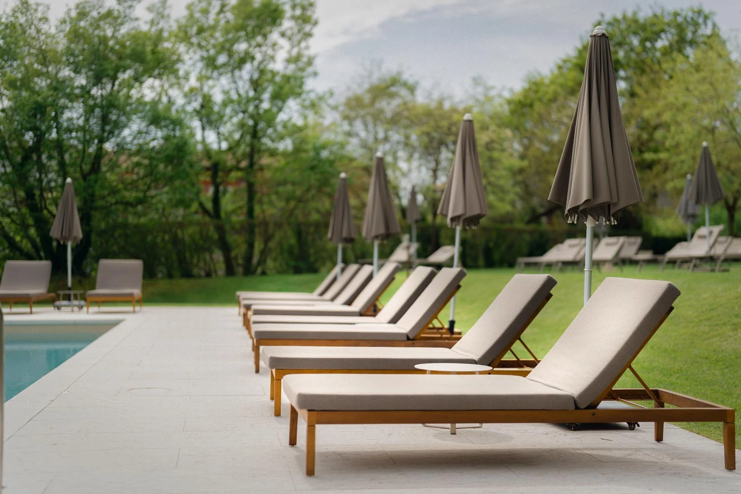 Iroko outdoor pool loungers, Relais Rossar, Lake Garda, BS Chairs — Interior Design